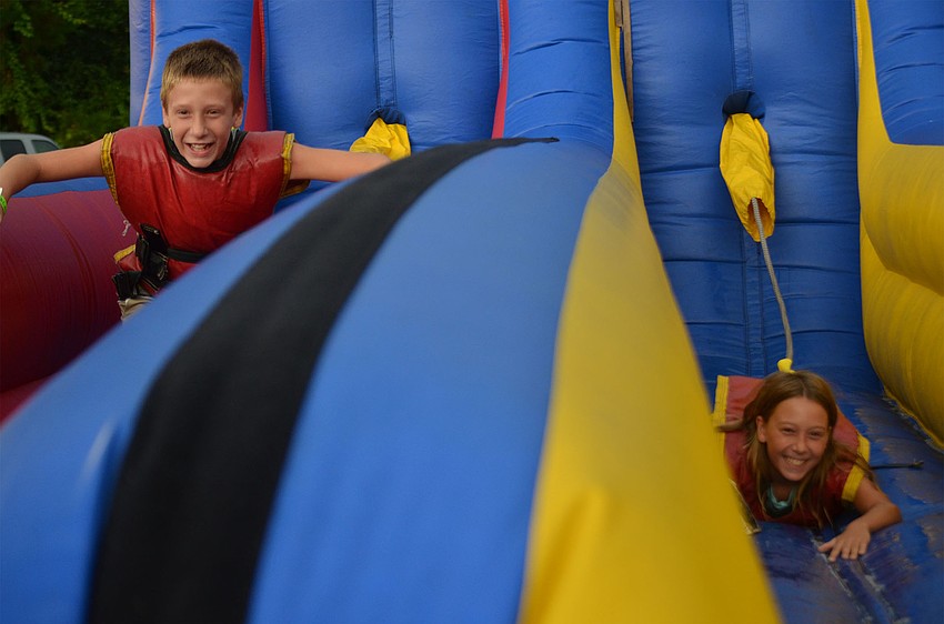 Corey Brown (left), 10, races his twin sister, Chloe Brown (right), 10, on the bungee-run game. Corey and Chloe are starting fifth grade this year at Manatee Charter School in Bradenton, Florida.