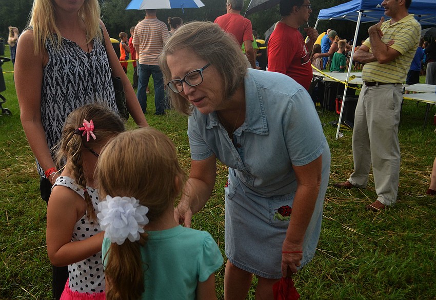 Kate Schau chats with her students, Cassidy Butler (right) and Jocelyn Gomez (left). Schau teaches kindergarten at Dunn Preparatory School.