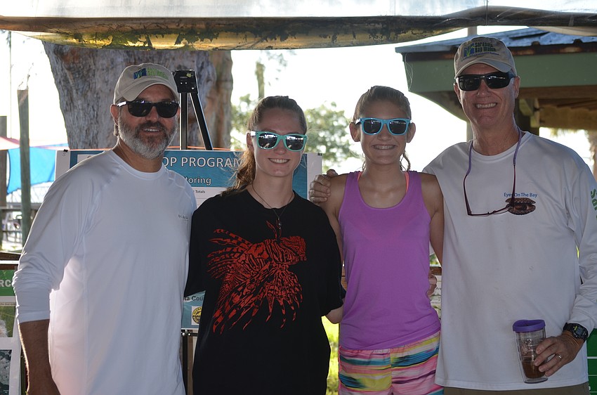 Past president Jeff Birnbach, Elizabeth Jeffrey, 13, Logan Giasson, 13, and board member Al Jeffrey