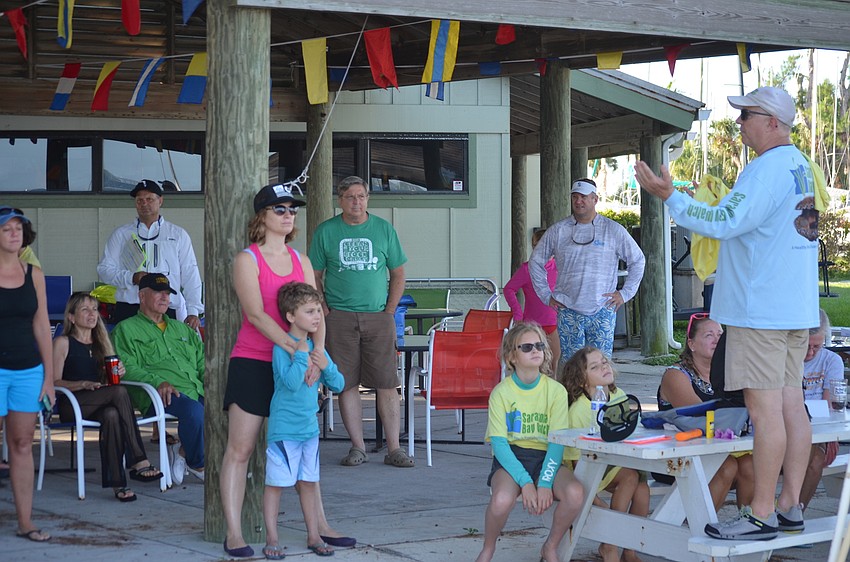 Sarasota Bay Watch President Larry Stults gives the scallop searchers instructions.