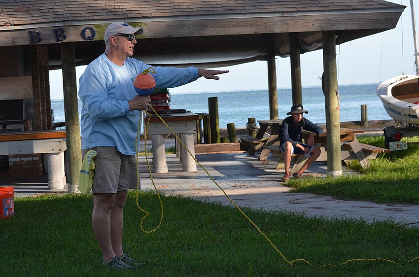 Sarasota Bay Watch President Larry Stults gives the scallop searchers instructions.
