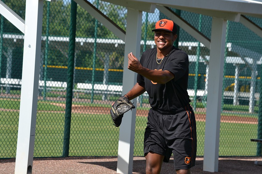 Brandon Bonilla participates in a pitching exercise with Girls Inc. of Sarasota County.