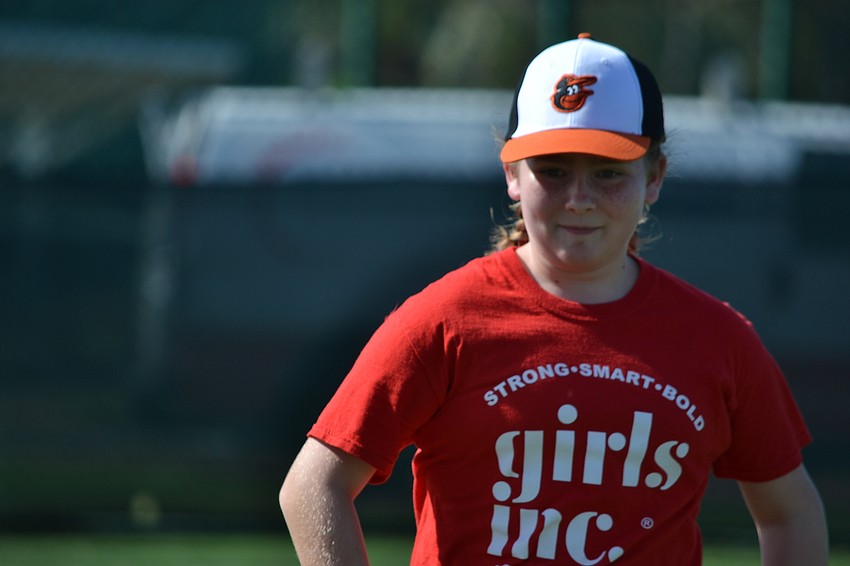 Ella Queen sprints to first base.