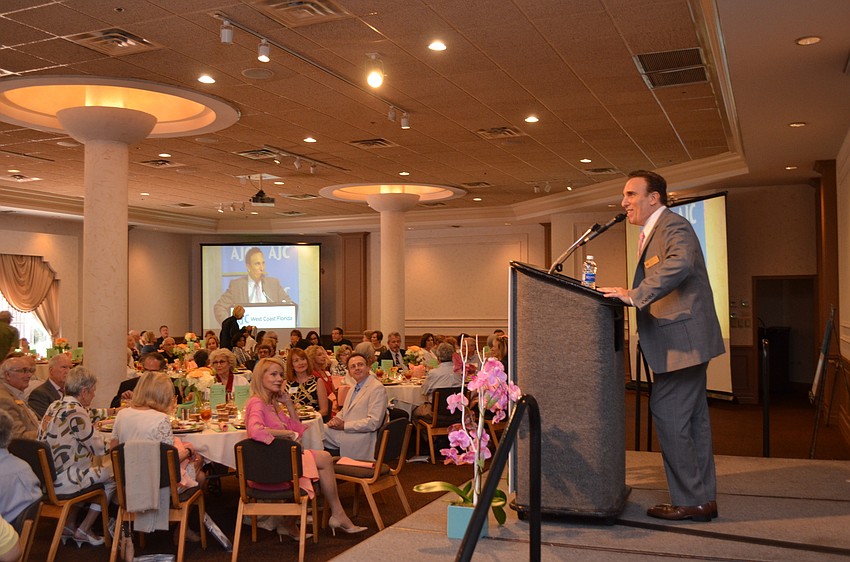 AJC Regional Director, West Coast Florida Brian Lipton explains the mission of AJC before announcing the next winner of the AJC Civic Achievement Award, Emily Walsh.