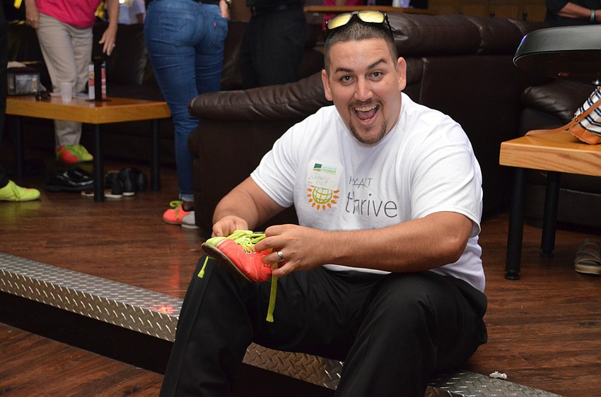 Johnny Kilduff laces up his bowling shoes for team Hyatt Regency of Sarasota.