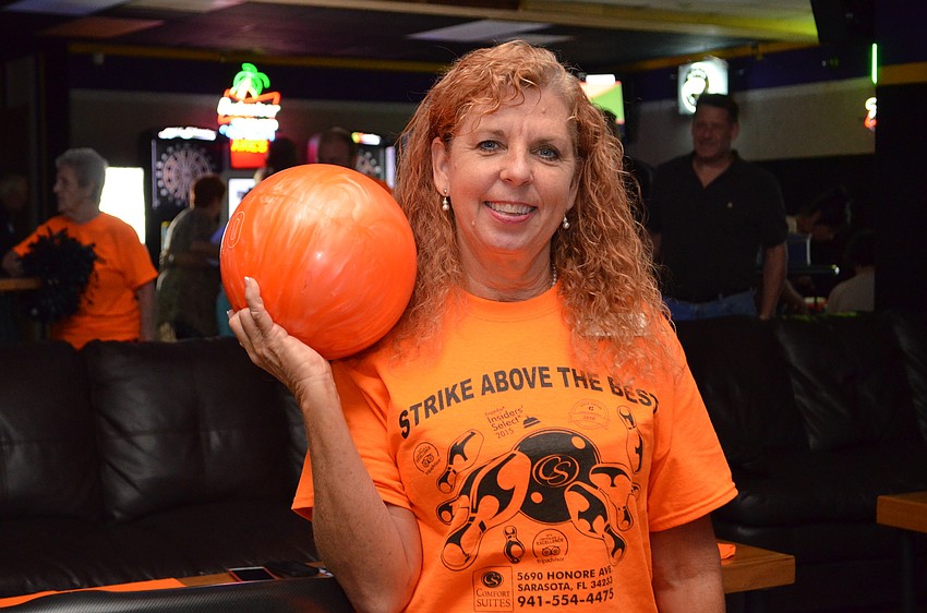 Laurie Pike matched her bowling ball to the Comfort Suites team T-shirts.
