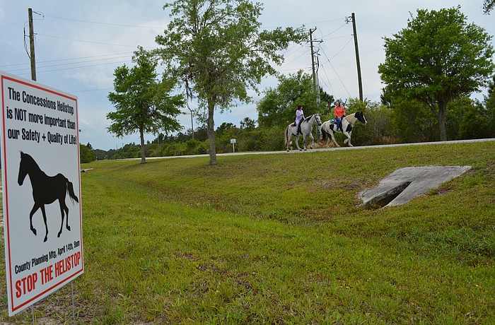 Panther Ridge homeowners have placed signs like this one throughout their community, as well as along State Road 70, to raise awareness within their community and neighboring ones. File photo.