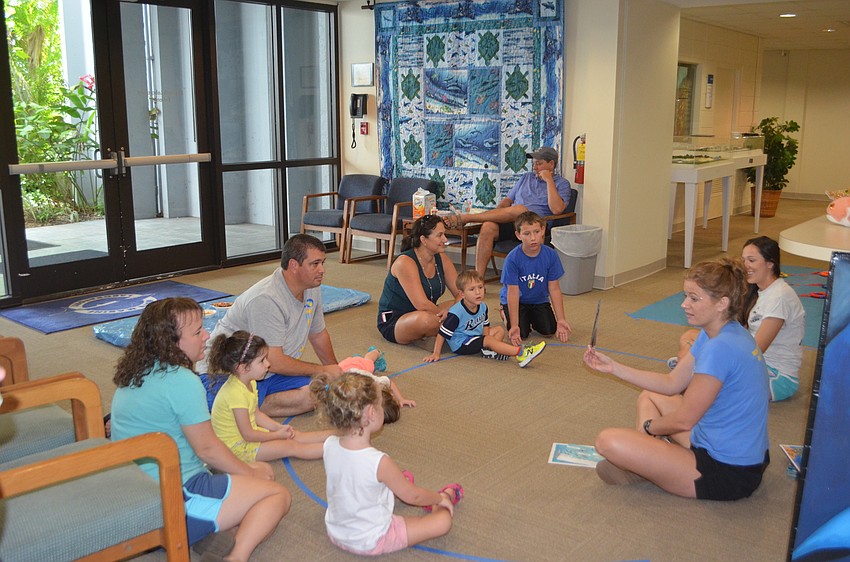 Mandy Wrobel, Senior Public Program Coordinator for Mote, leads a Mommy and Me session.