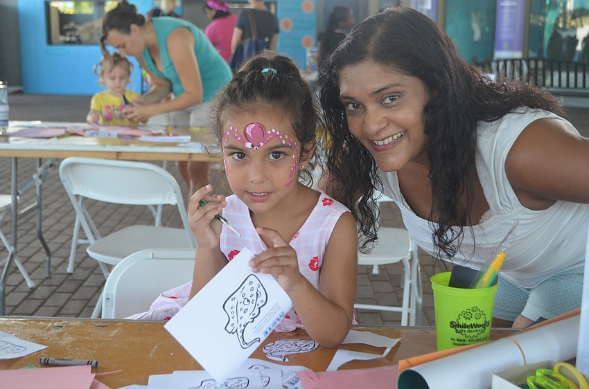 Mila Harvey, 4, with her mom, Trisha