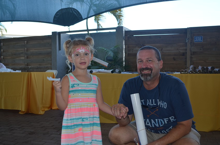 Lilliana James, 4 enjoys the Gummy Sharks performance with her dad, Michael.