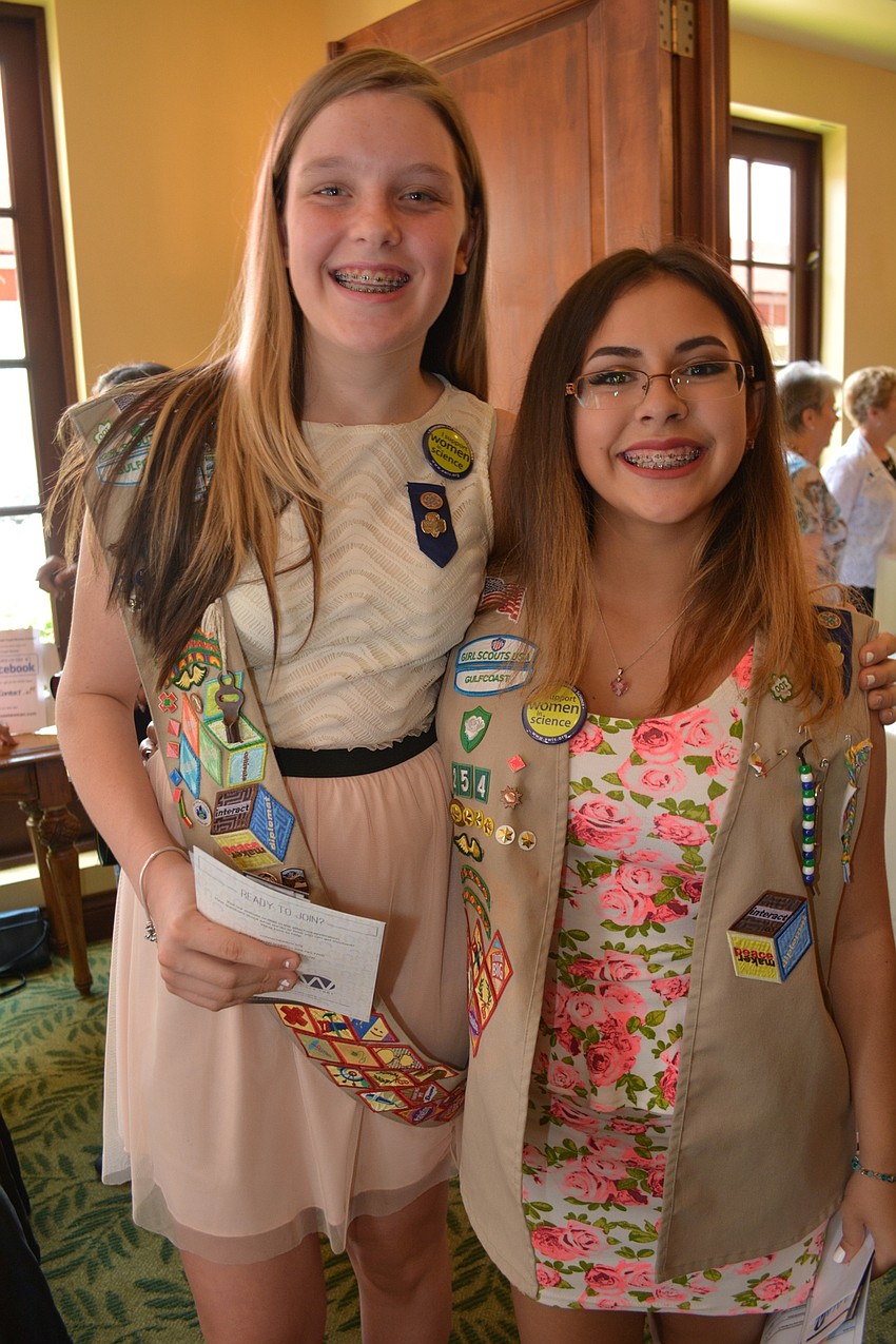 Izy Burns and Tonianne Gianakouros, of Girl Scout Troop 254, check out informational booths.