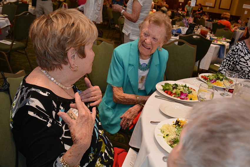 Georgie Ann Feddako, in black, chats with friends Pat Dye, in teal, and Barbara Stevens, not pictured.
