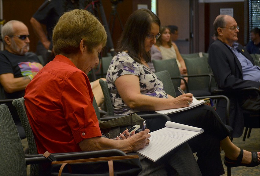 Republican candidate for the State Senate Nora Patterson takes notes during the preceding panels. Patterson participated in the final panel along with her opponents Rick Levine, Ray Pilon and Greg Steube.
