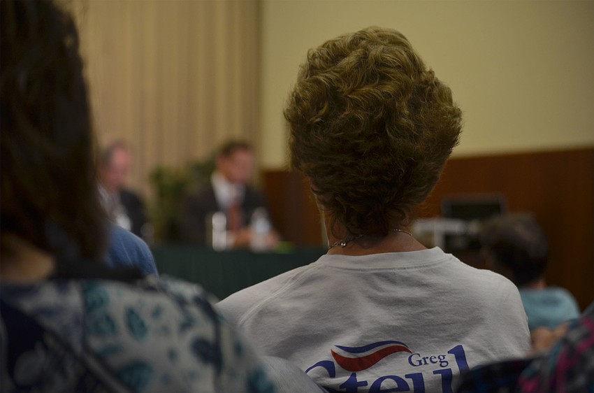 Debbie Steube, mother of Republican candidate for the State Senate, District 23, wears one of her son's campaign t-shirts while participating in the panel.