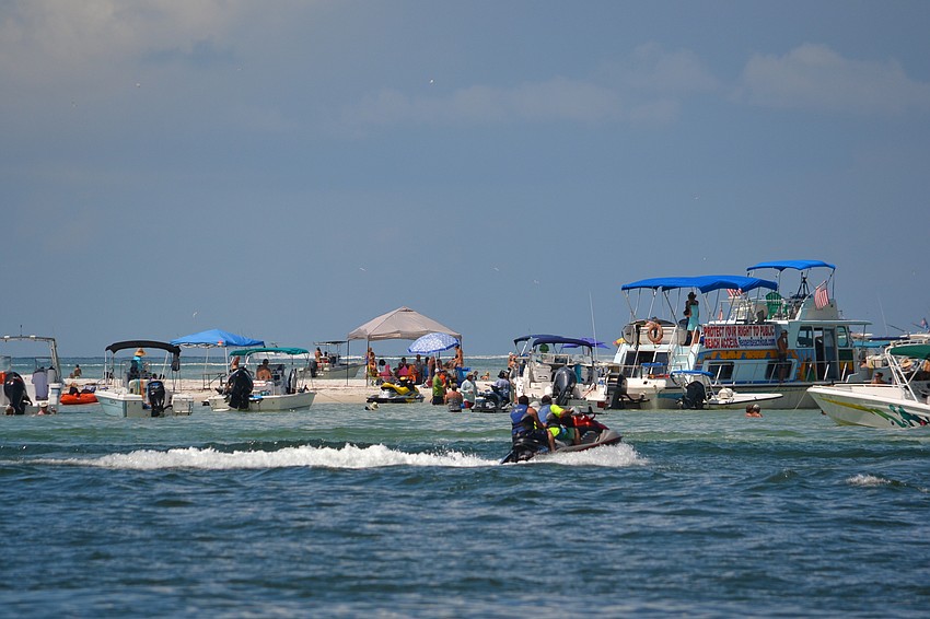Residents came by boat and personal watercraft for the second Party on the Pass hosted by Save Our Siesta Sand 2 a group in opposition to the dredging of Big Pass.