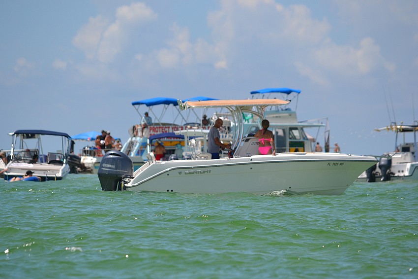 Party on the Pass Organizer Rick Schineller estimates at least 100 boats and watercraft were docked at the Big Pass sandbar.