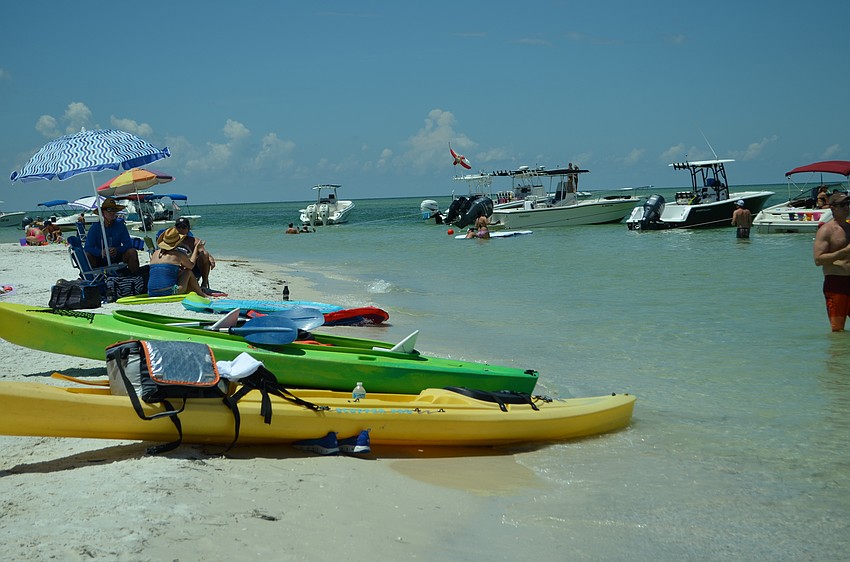Boats, paddleboards and kayaks all pulled up to the sandbar on Big Pass Sunday afternoon for the second Party on the Pass.