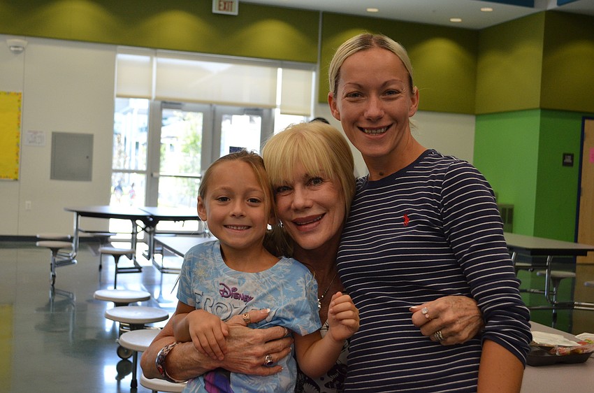 Ella Hornberger enjoys breakfast before her first day of Kindergarten with Vicki and Jen Hornberger.