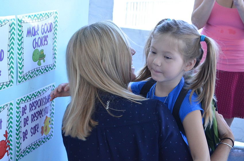 Simone Vaccaro greets her new Kindergarten teacher  Jeannette Nowaski.