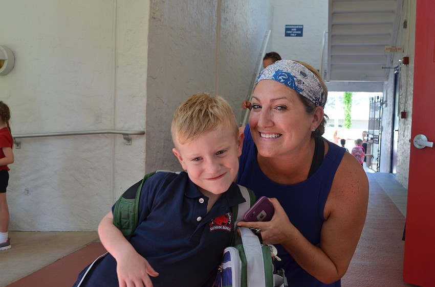 Chase Carland and his mother Jill at pick up time for Southside Elementary School.