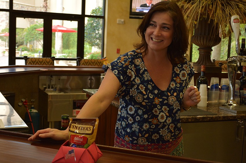 Rita Warner pours drinks for guests.