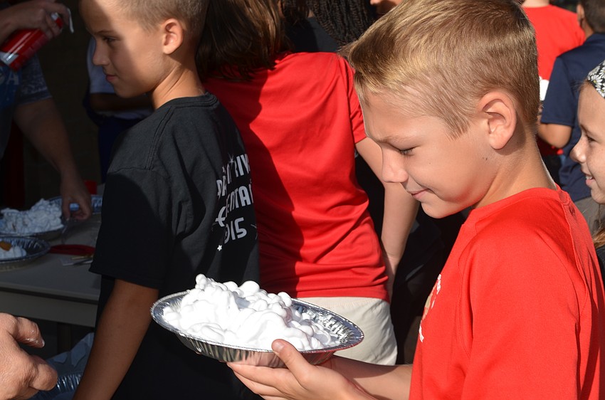 Kaden Tribble holds his pie.