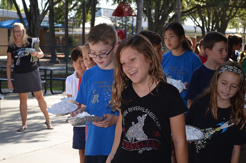 Jenna Davis and Landon Ling wait in line to throw their pies.