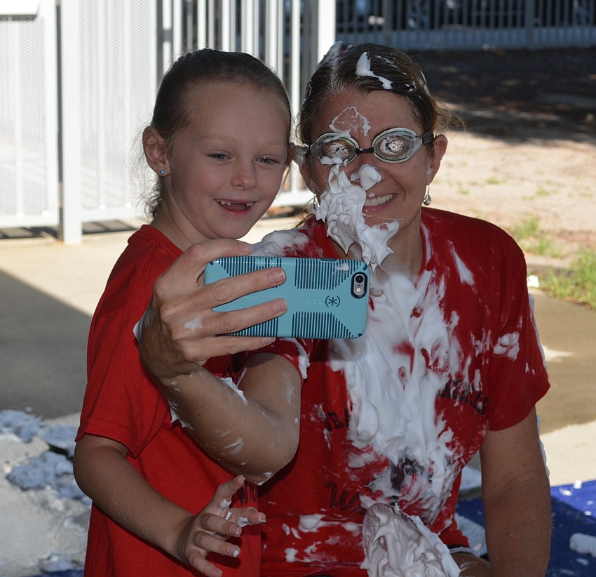 Principal Hayley Rio takes a selfie with Lily Harris.