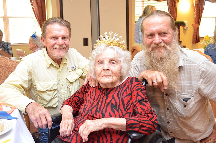 Thelma McKahan is joined by her two sons Bob, left, and Gene, right.