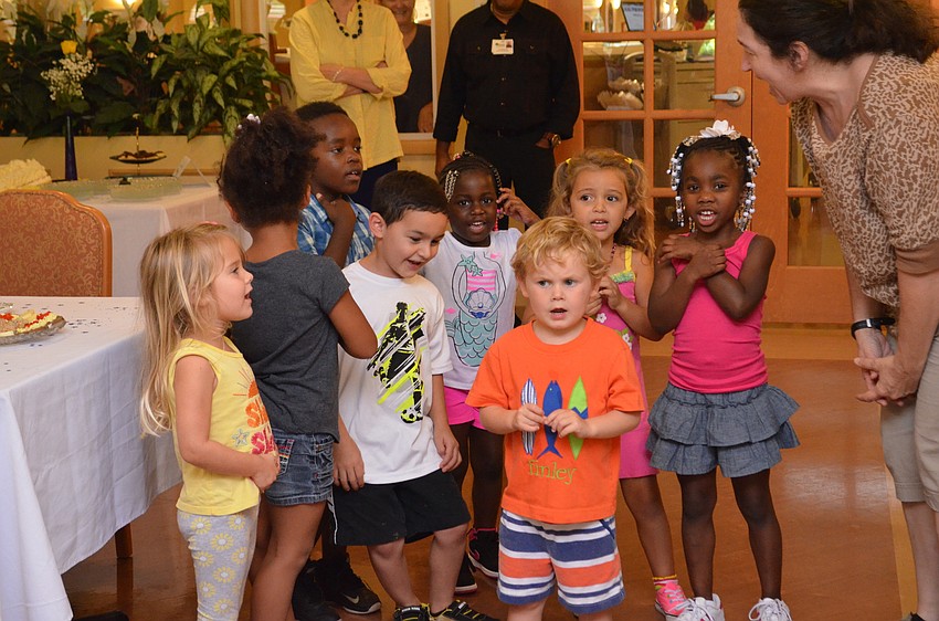 Students from the on-campus daycare center crashed the party to wish a happy birthday to their 