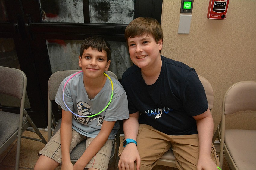 Matthew Lanni and Brendan Mendel catch up. Brendan's brother, Kevin, served as the night's disc jockey.