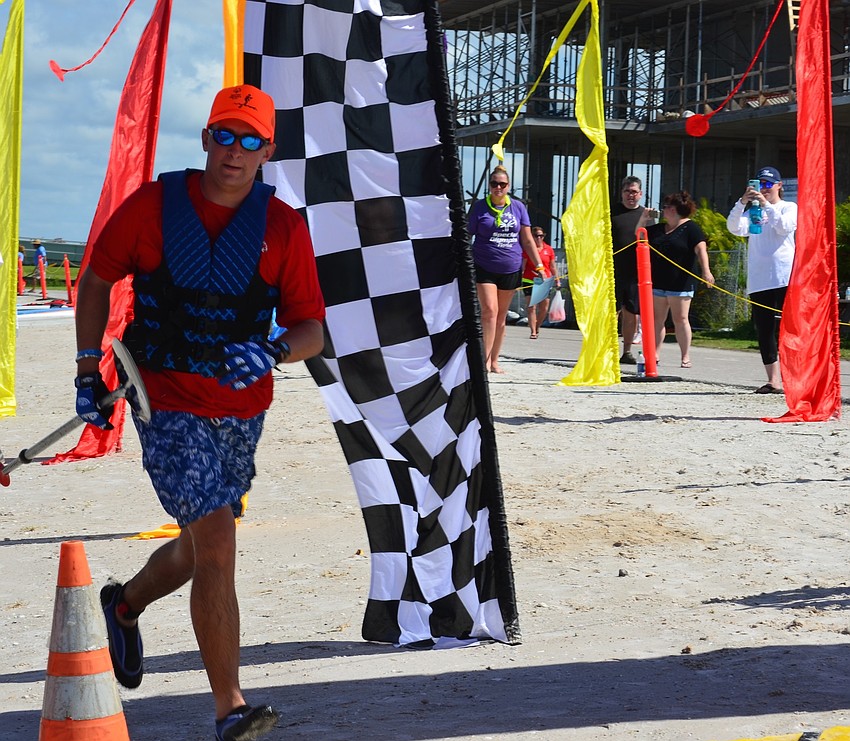 Matthew Dalton from Islamorada races through the finish line after a long race.
