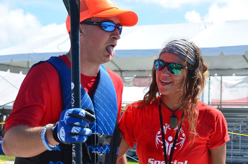 Tired after a hard race, Matthew Dalton meets his coach, Lou Gillespie, at the finish line.