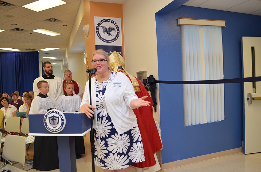 Connie Taft addresses students and faculty members during an assembly and Mass to celebrate the new name for St. Mary Academy.