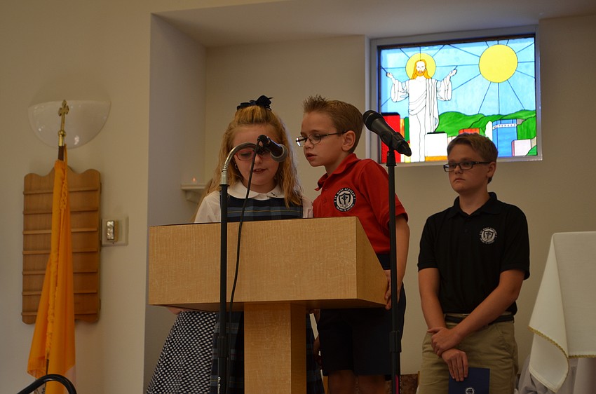 St. Martha Catholic School students Jasmine Antico and Owen Galvin recite the new motto for St. Mary Academy.