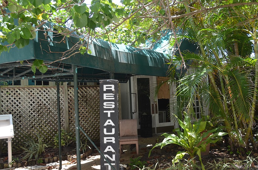 The front door to the former Colony Resort on Longboat Key gapes open. It has not yet been approved for demolition.