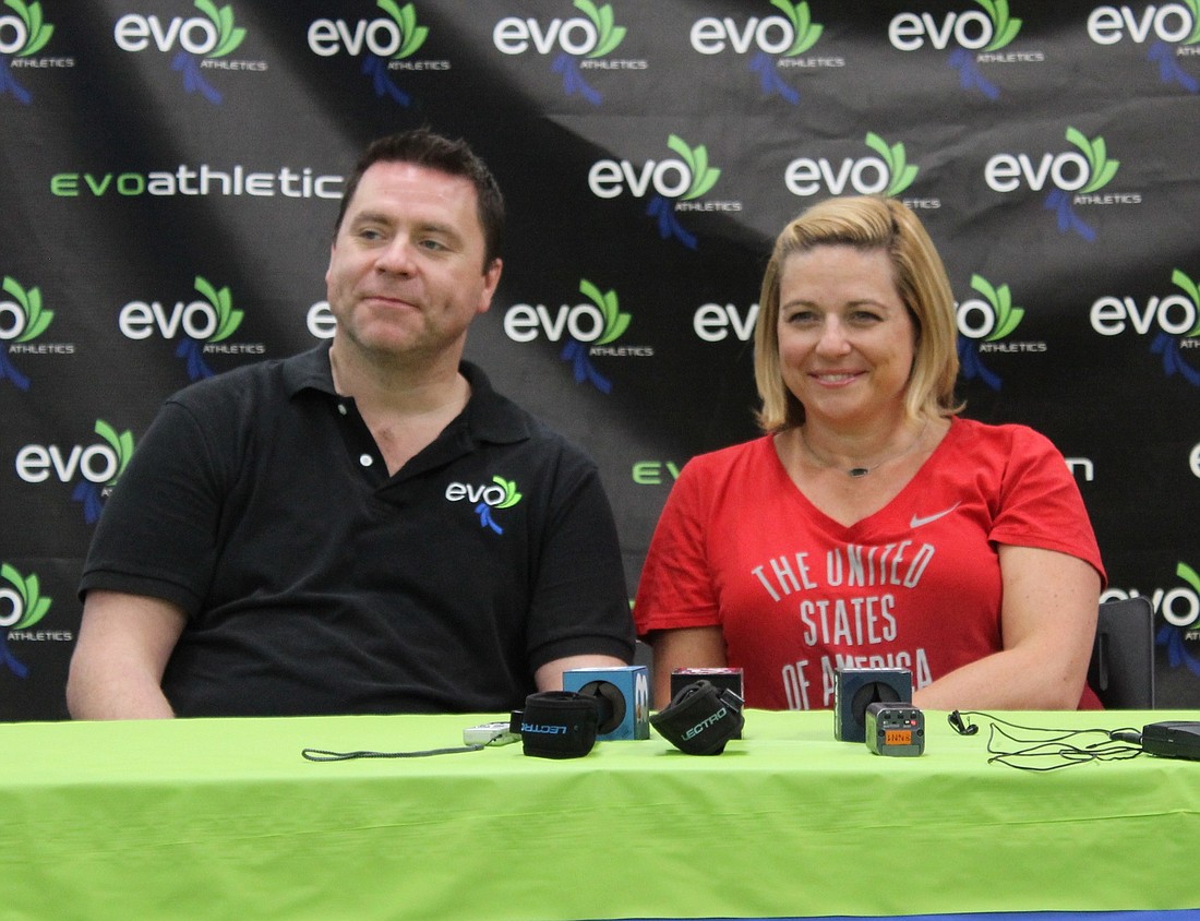 Jason Collins, VP & chief athletics officer, sits next to Aimee Boorman, the new director of women's and elite gymnastics at EVO Athletics.
