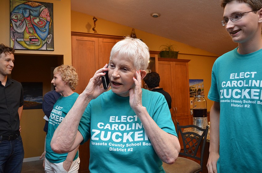 Sarasota County School Board member Caroline Zucker gets the call that with one precinct left to report she has a strong enough lead to declare a victory.