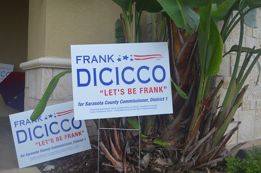 Signs supporting Frank DiCicco for county commission were posted outside of Peeple’s Insurance Agency.