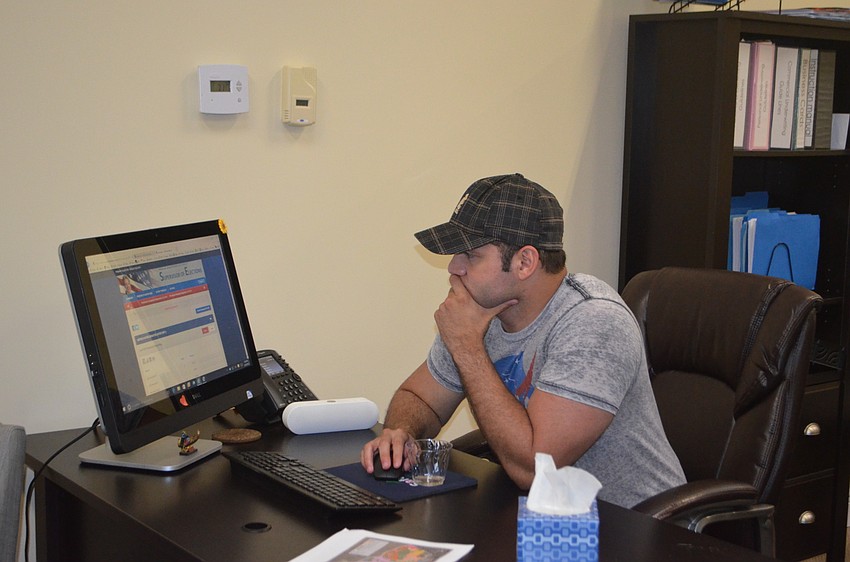 DiCicco campaign manager Erik Arroyo waits for results to come in.