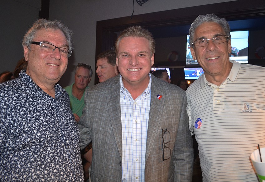 Republican candidate for the District 1 Sarasota County Commission seat Mike Moran (middle) poses with Avi Yoskowitz (left) and Harvey Wasserman (right) at Teresa Mast's campaign watch party.