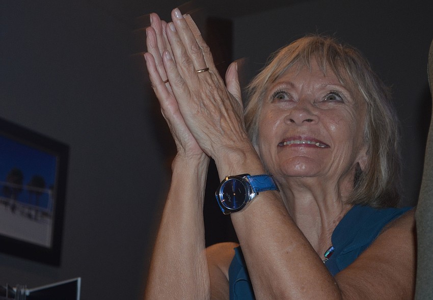 Linda Grieves applauds as Teresa Mast prepares to address her family and friends after final results showed her winning only 47.5% of the vote.