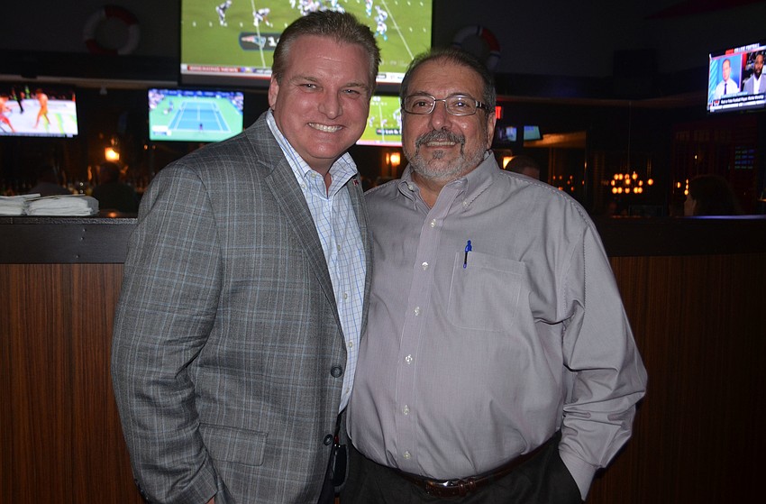 Republican candidate for the District 1 Sarasota County Commission poses with Sarasota County Commissioner Alan Maio at the Gecko's Grill on Cattleman after final results for Tuesday's primary were released.