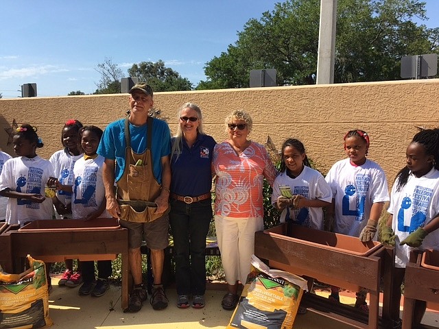 Courtesy photo. Returned Peace Corps Volunteers of Gulf Coast of Florida members Phil Yoder, Jule Doran and Jan Mazer after helping rebuild the reading garden at the North Sarasota Public Library.