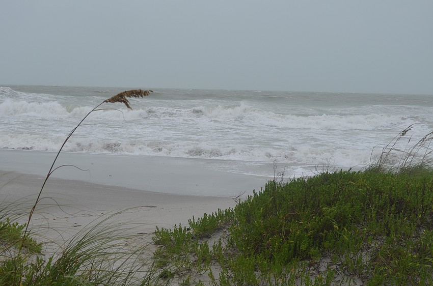 Storm surge off Longboat Key beaches have contributed to flooding on the island.