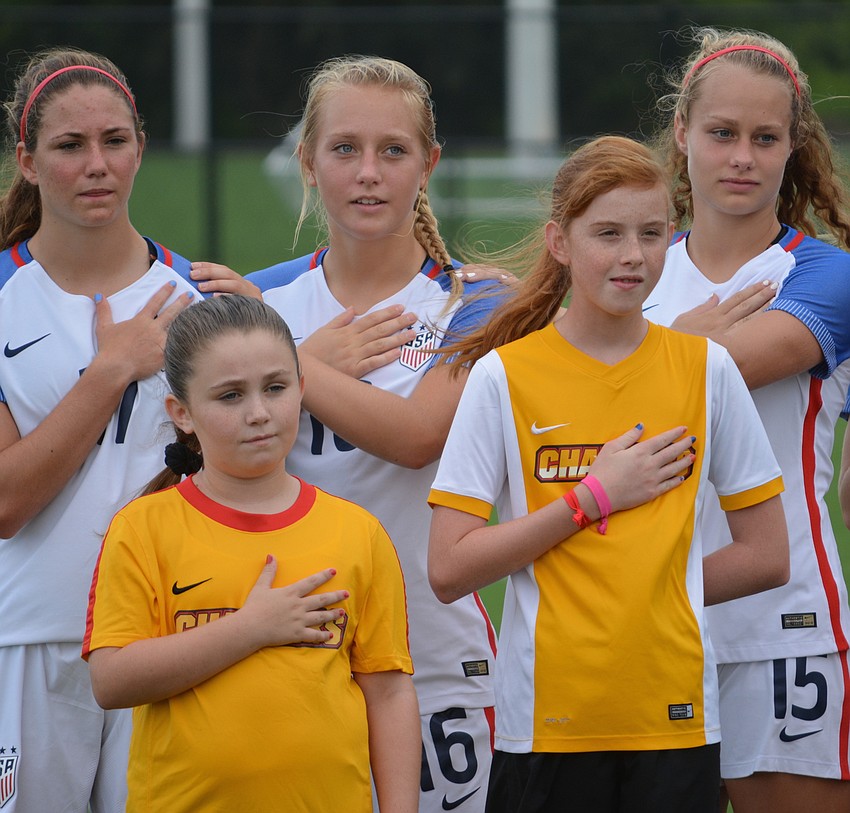 Members of the Chargers joined the U.S. U-17 Women's National Team for the playing of the National Anthem.