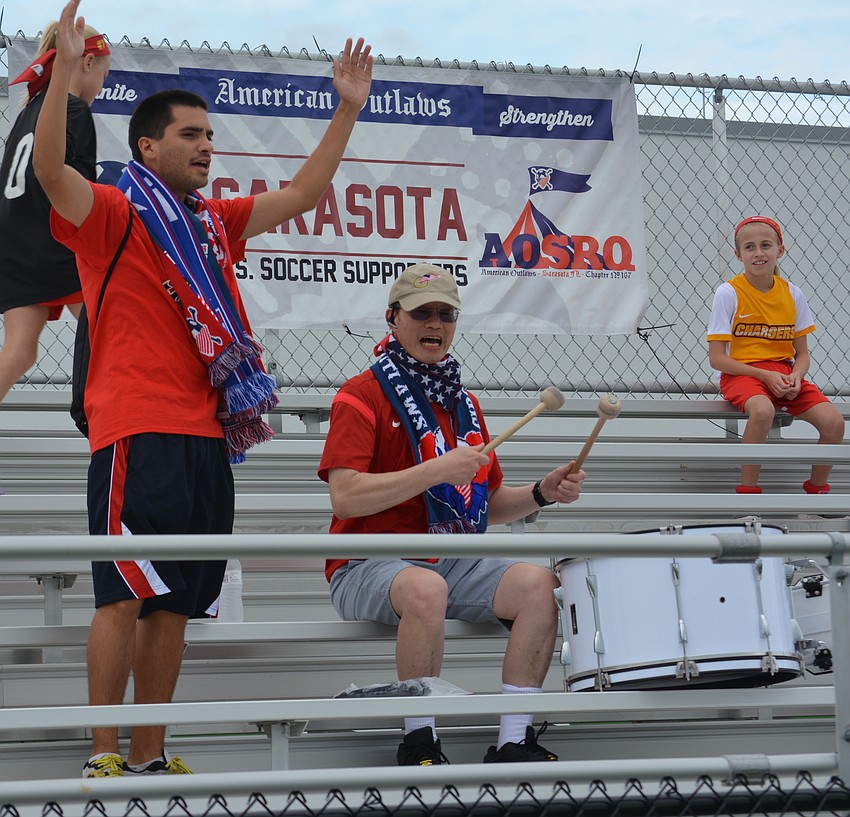 Brent Cartagena and Ron Chin, members of the Sarasota American Outlaws group that supports U.S. Soccer, get a little wild.