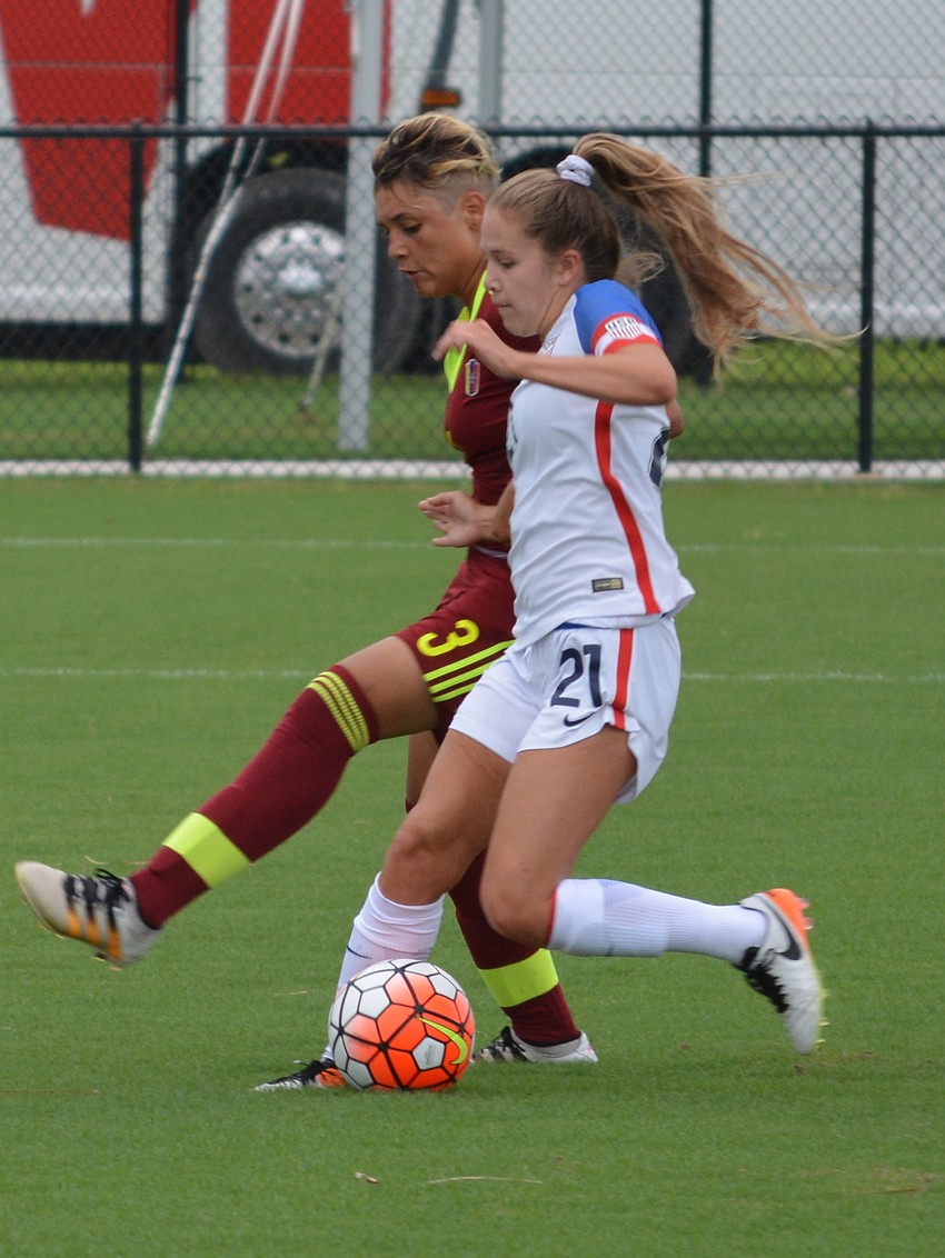 Ashley Sanchez slips past Venezuela's Sandra Luzardo.