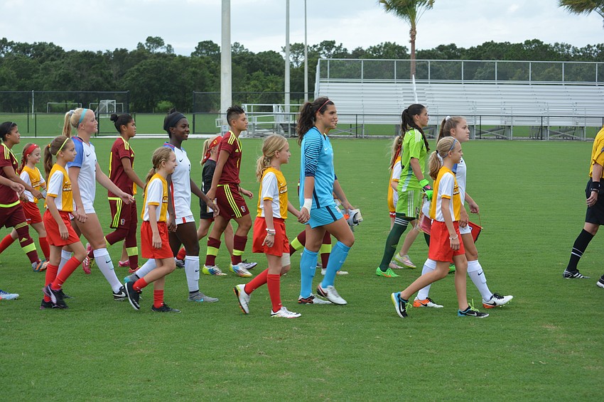Members of the Lakewood Ranch Chargers had the honor of escorting national team members on the field.