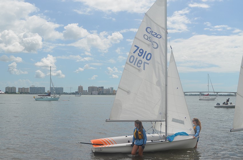 Ashley See, 13, and her sister, Alyssa 15, get ready to set sail.